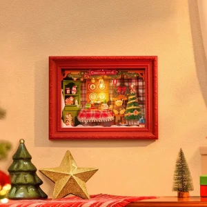 Puzzle 3D en bois Rolife Santa’s Toy Shop DP006 représentant une boutique de jouets de Noël miniature illuminée, avec sapin enneigé, cadeaux, porte rouge et cadre décoratif blanc.