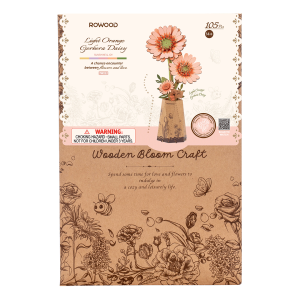 Puzzle 3D en bois Rowood Light Orange Gerbera TW111 représentant trois fleurs de gerbera orange clair avec leurs feuilles vertes dans un vase décoratif en papier.