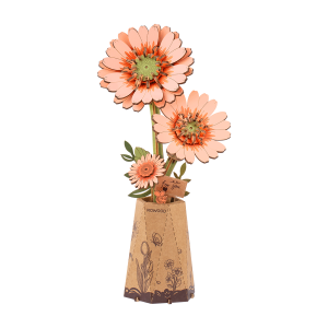 Puzzle 3D en bois Rowood Light Orange Gerbera TW111 représentant trois fleurs de gerbera orange clair avec leurs feuilles vertes dans un vase décoratif en papier.