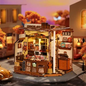 Rolife Henry’s Chocolate DG174, maison miniature DIY représentant une chocolaterie artisanale avec chocolats, pralines, étagères en bois, comptoir et éclairage LED.